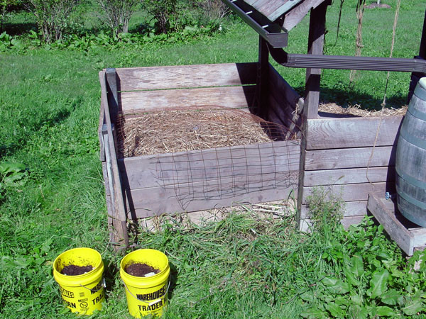 humanure about to be emptied into a compost bin